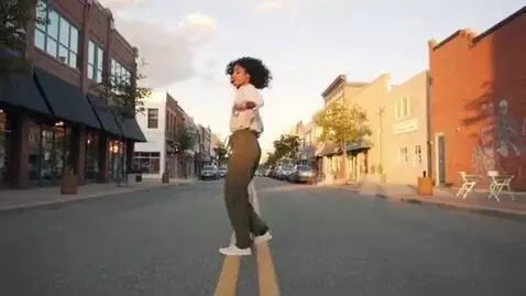 AI Video from prompt: A girl dancing in the street