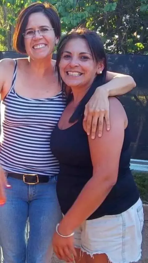 AI Video from prompt: The tallest woman hugs another woman of similar 