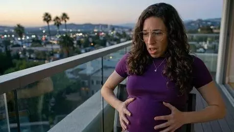 AI Video from prompt: Stephanie is extremely bloated and her stomach i