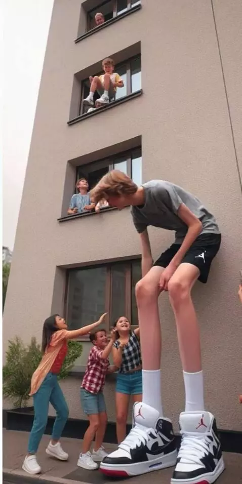 AI Video from prompt: The tall boy moves a little, picks up the boy wh