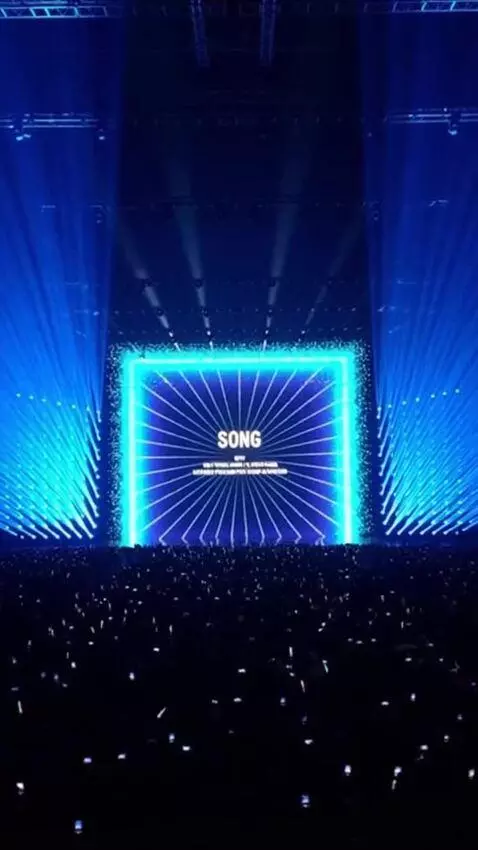 AI Video from prompt: A massive, futuristic international song contest