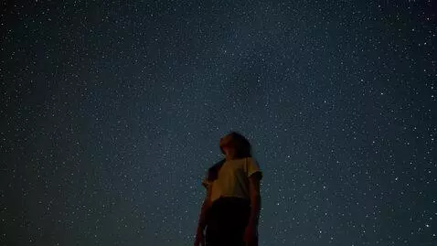 AI Video from prompt: the night sky. The camera slowly moves away from