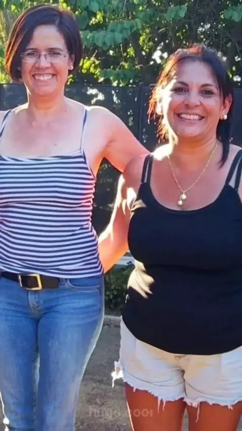 AI Video from prompt: The women turn around and shows off her clothes