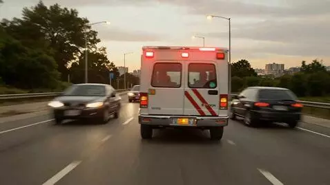 AI Video from prompt: An ambulance rushes to a call on the outskirts o