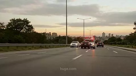 AI Video from prompt: An ambulance rushes to a call and makes a turn