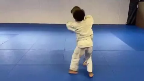 AI Video from prompt: two boys at six years,wearing cream bjj jackets,