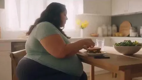 AI Video from prompt: a montage of beautiful woman becoming hugely obe