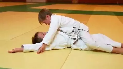AI Video from prompt: Two boys at six years,wearing judo jackets,white