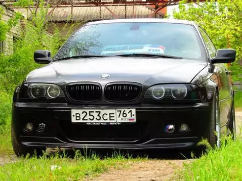 AI Video from prompt: Cinematic low-angle shot of a black BMW E46 seda