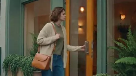 AI Video from prompt: a mousy slim woman enters a spa. when she comes 