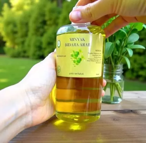AI Video from prompt: A hand gently picks up a bottle of Sidr Oil (Bid