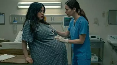 AI Video from prompt: The pregnant woman's belly is gurgling and bulgi