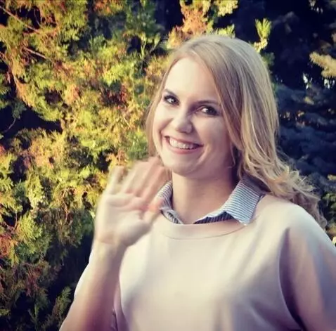AI Video from prompt: the girl waves her hand and says hi, Max, how ar