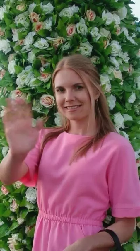 AI Video from prompt: the girl waves her hand and blows a kiss