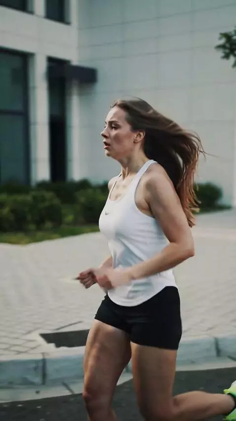 AI Video from prompt: A young girl of 25 years old is running through 