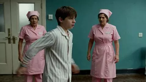 AI Video from prompt: A boy hospital patient runs to a pool and jumps 