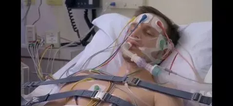 AI Video from prompt: Have the patient slowly open his eyes. Have a wo