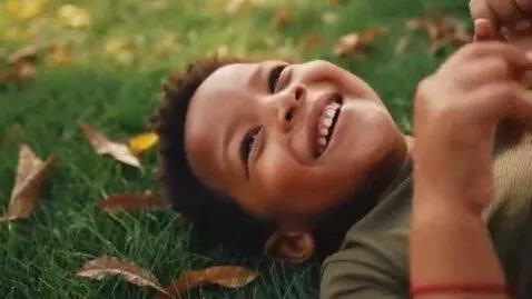 AI Video from prompt: Kid boy lay on ground and show his feet in my di
