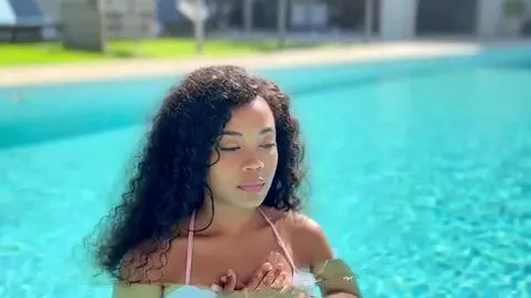 AI Video from prompt: In a clear and tranquil swimming pool, a woman s
