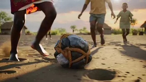 AI Video from prompt: > **A rural African sandy football field at suns
