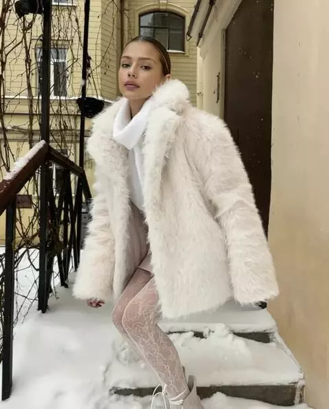 AI Video from prompt: The girl gets to her feet and straightens her sk