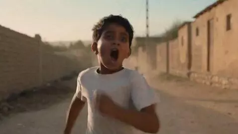 AI Video from prompt: A 10-year-old boy wearing blue pants and a white