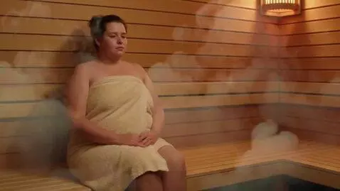 AI Video from prompt: a woman at a sauna. the steam grows thicker in t