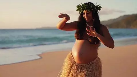 AI Video from prompt: Make a video of a pregnant woman wearing a hula 
