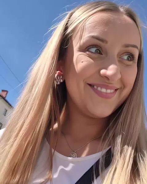 AI Video from prompt: face close up, looking at camera, shy smile, eye