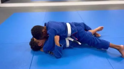 AI Video from prompt: two boys at six years,wearing blue bjj jackets,w
