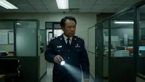 AI Video from prompt: A security guard walks around the office at nigh