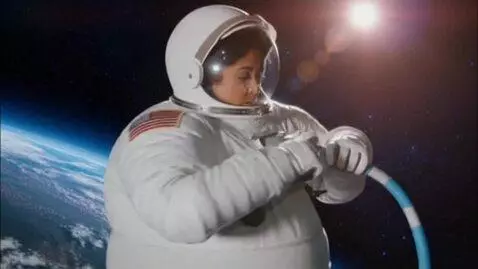AI Video from prompt: a Latina astronaut  in space. she connects a hos