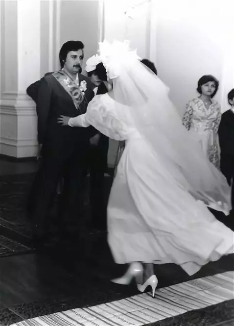 AI Video from prompt: a young dark-haired bride in a wedding dress, wi