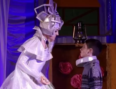 AI Video from prompt: A charming forty-year-old snow queen with a silv