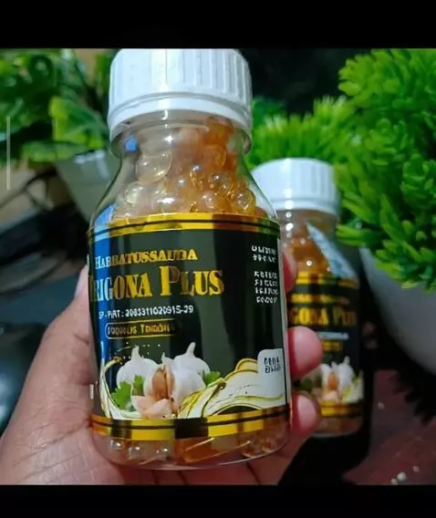 AI Video from prompt: A hand gently picks up a bottle of Habbatussauda
