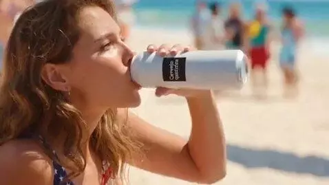 AI Video from prompt: A beach party. A 20 year old woman in an America