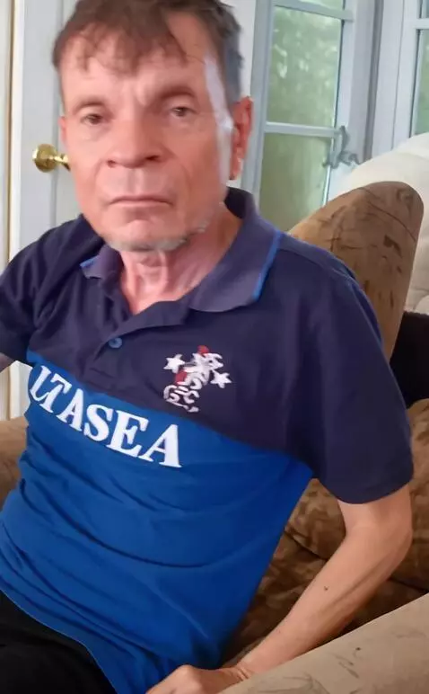 AI Video from prompt: The guy gets up from the couch and looks at the 