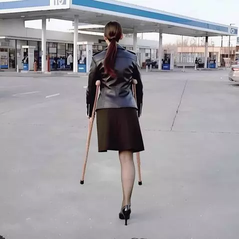 AI Video from prompt: A beautiful one-legged woman turns her back to t