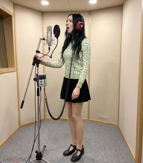 AI Video from prompt: A woman wearing headphones is actively singing i
