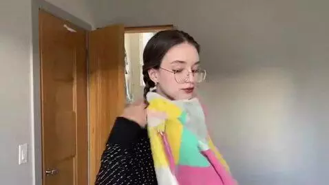 AI Video from prompt: The girl pulls her T-shirt over her head