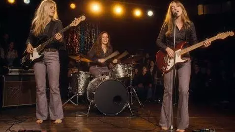 AI Video from prompt: 3 smiling young women, all barefoot with slightl