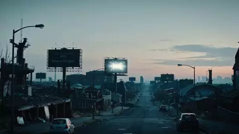 AI Video from prompt: Wide static establishing shot at dawn, an abando
