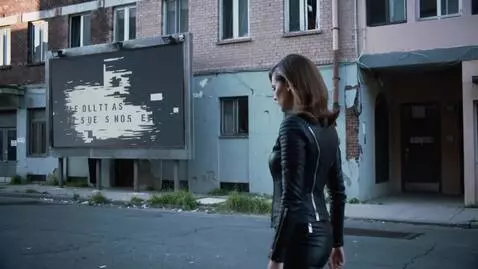 AI Video from prompt: A young woman (black leather clothes, 20 years o