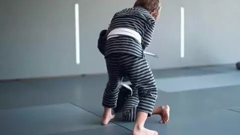 AI Video from prompt: two boys at six years,wearing striped bjj jacket