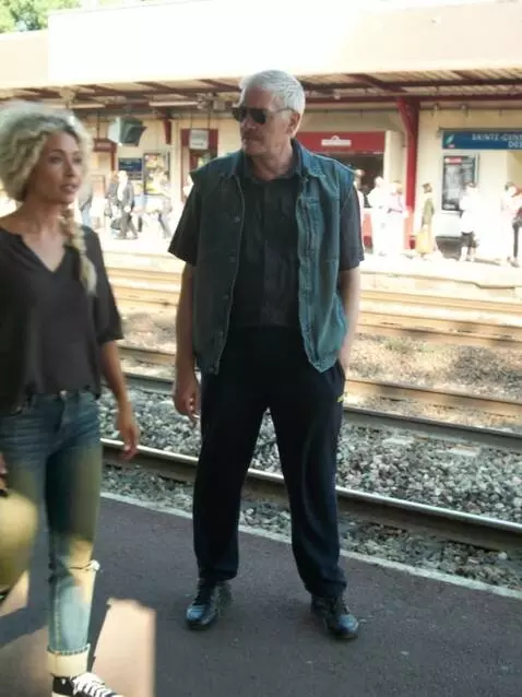 AI Video from prompt: A man is walking along a dirt road with a beauti