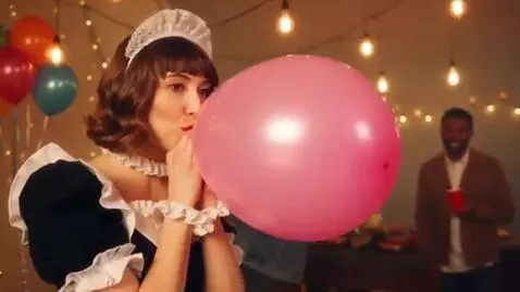 AI Video from prompt: A woman in a French maid costume blows up a ball