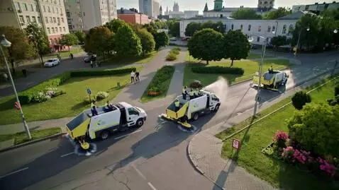 AI Video from prompt: Aerial drone shot of clean streets, green parks 