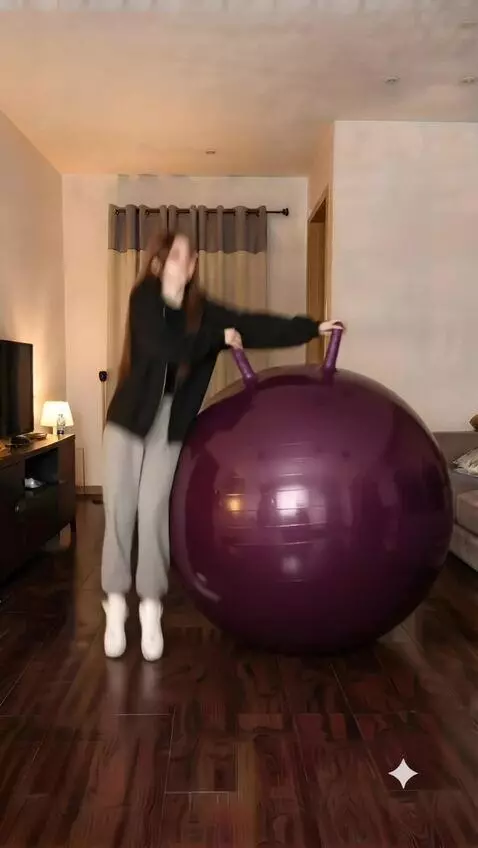 AI Video from prompt: The girl sits on a purple fitball and the girl s