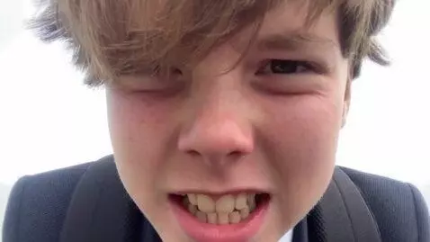AI Video from prompt: Make this person be really shocked and whisperin