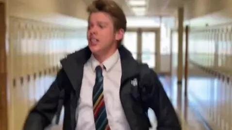 AI Video from prompt: Make this person run through a school hallway an